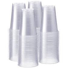 Stacks of clear disposable plastic cold drink cups for restaurant beverage service
